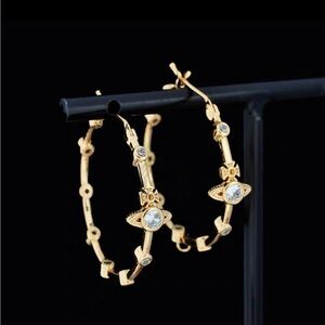 - Vivienne westwood bamboo Saturn earrings gold